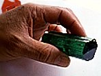 Hold the emerald in your hand to examine it